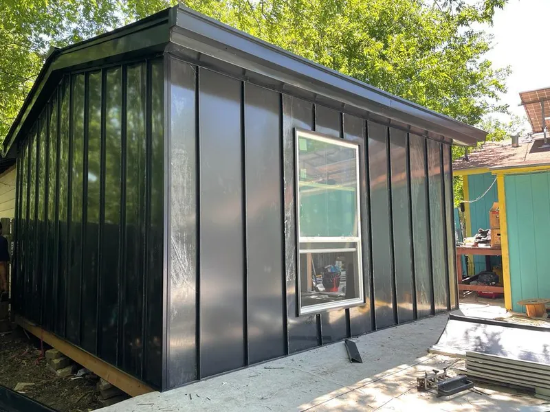 Black standing seam metal wall panels for Metal Roof Installation in Powell